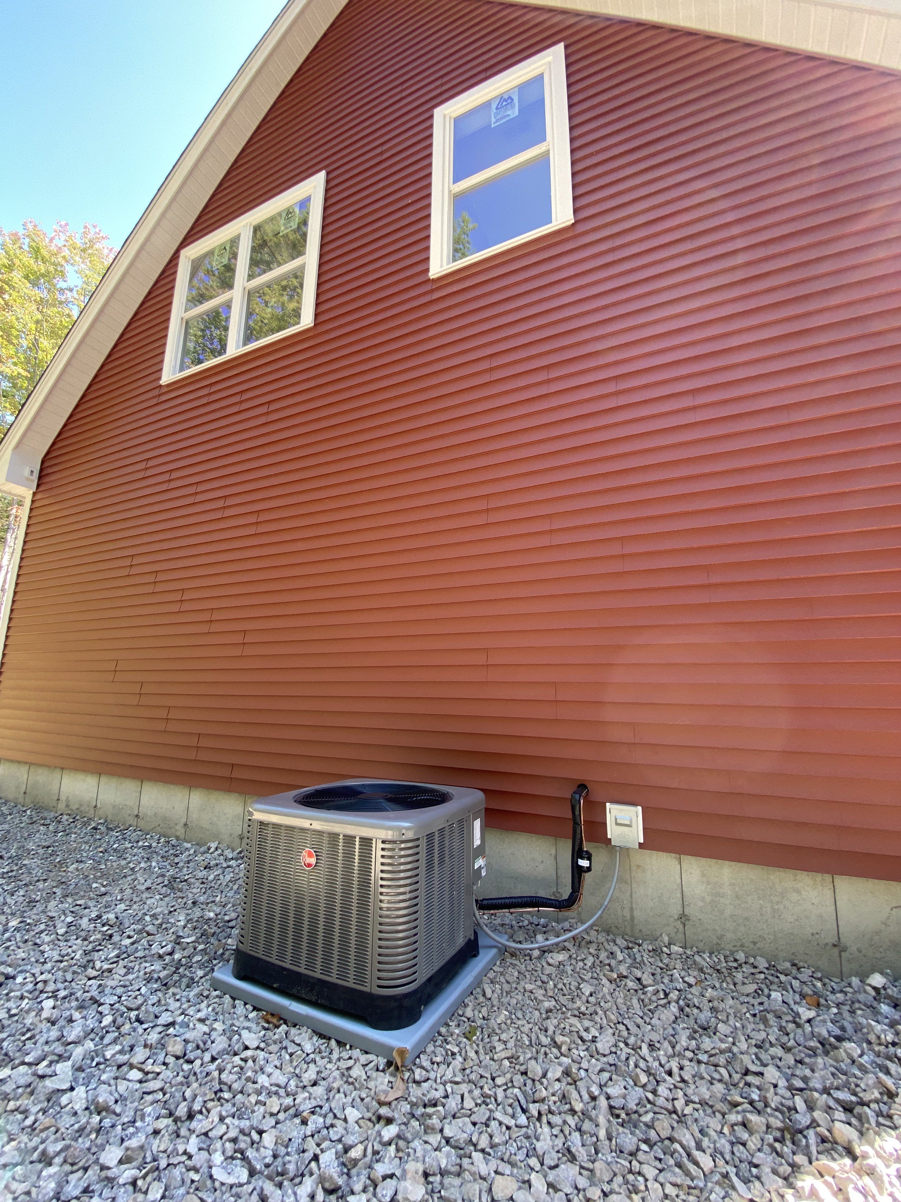 Rheem AC Condenser on Gravel Bed